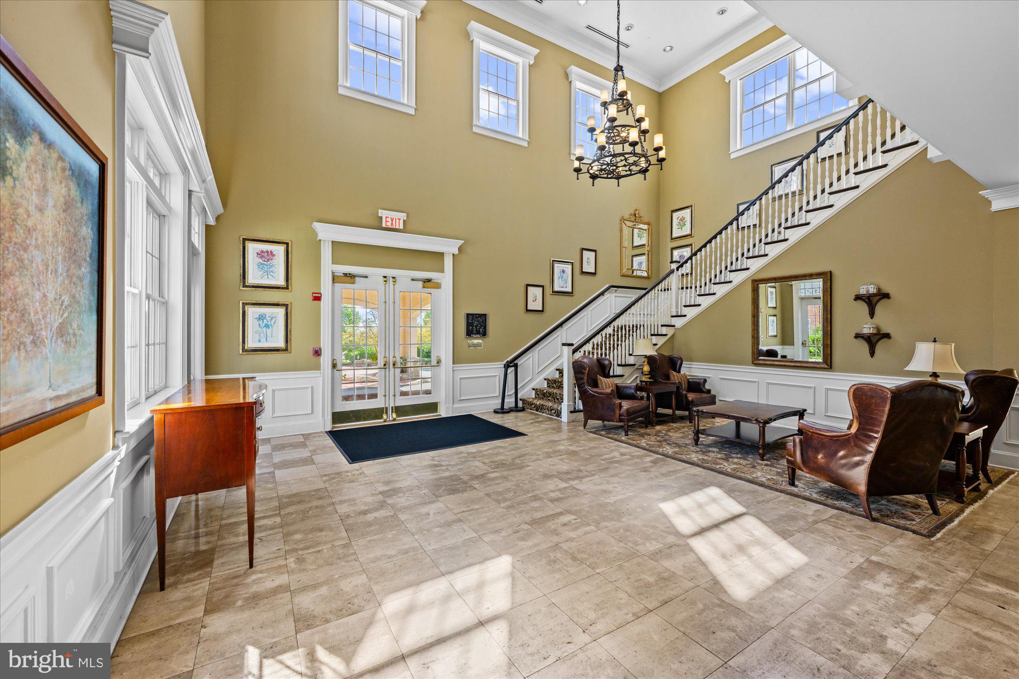 20026 Valhalla Square Ashburn, VA 20147 - Photo 42 of 82 a view of an entryway with furniture wooden floor and windows