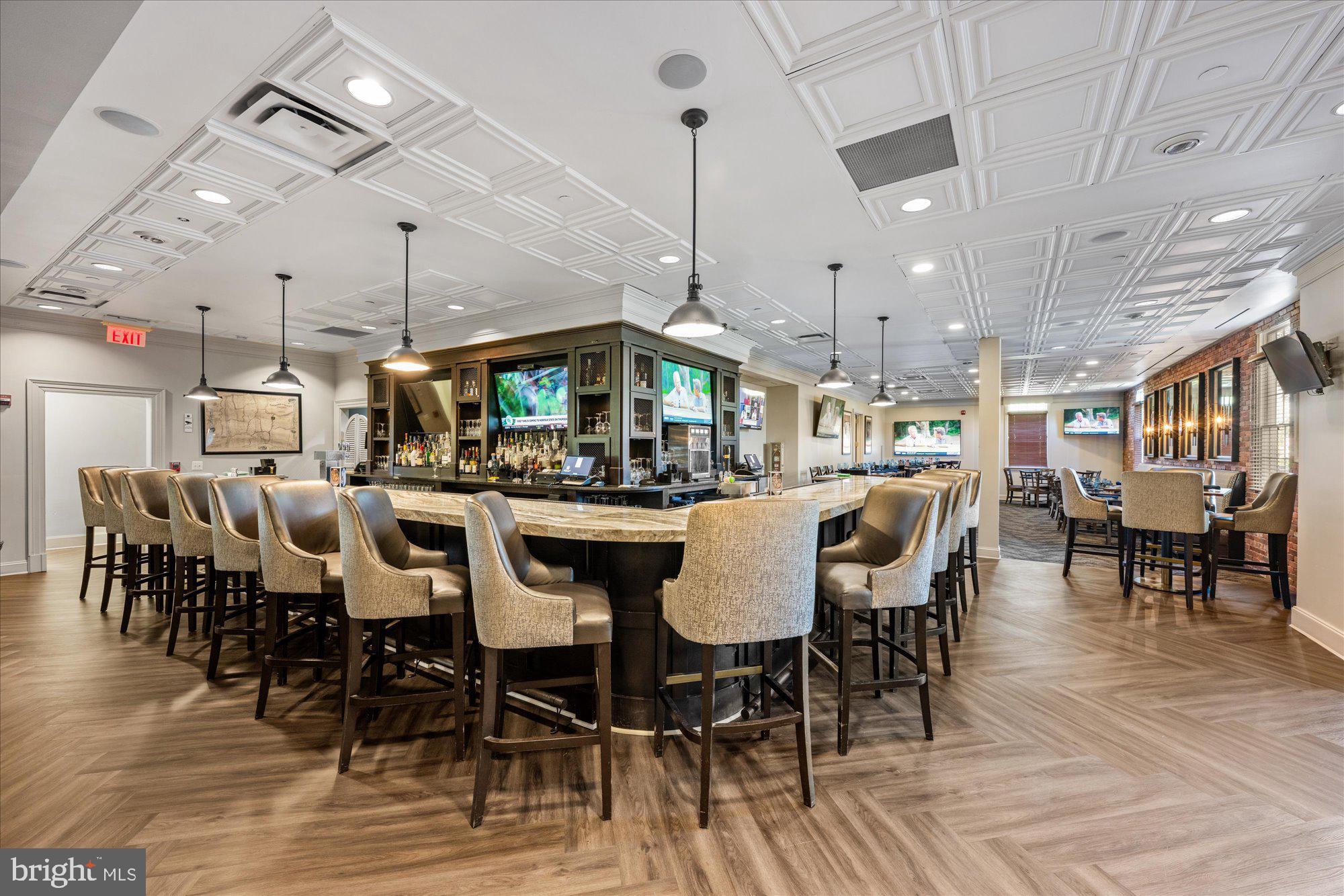 20026 Valhalla Square Ashburn, VA 20147 - Photo 49 of 82 a dining hall with stainless steel appliances a dining table and chairs with wooden floor