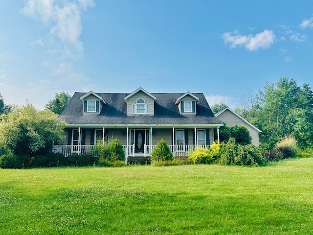 2916 Ninevah Road Knox, PA 16232 - Photo 2 of 42 a front view of a house with a garden and plants