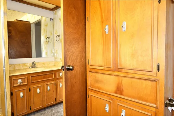 a bathroom with a double vanity sink and mirror