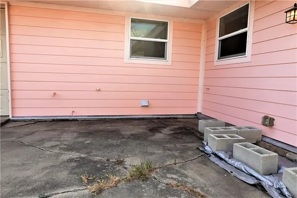 a view of a backyard of the house