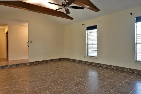 a view of an empty room with a window