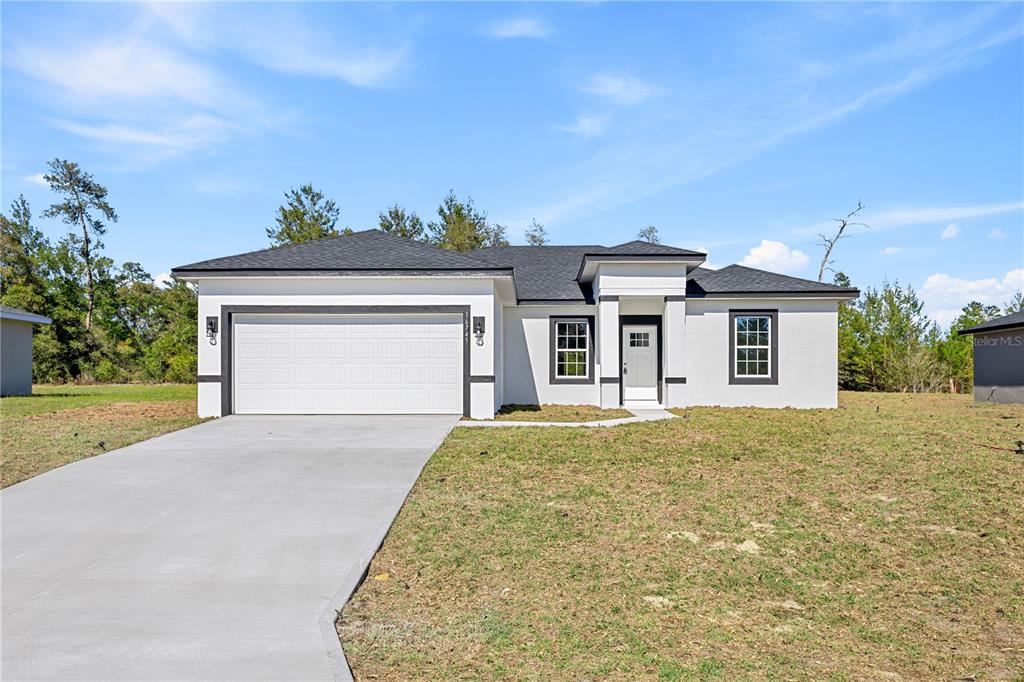 16745 Southwest 29th Terrace Ocala, FL 34473 - Photo 1 of 1 front view of a house with a yard