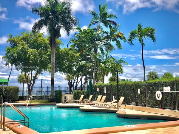 a view of swimming pool with outdoor seating