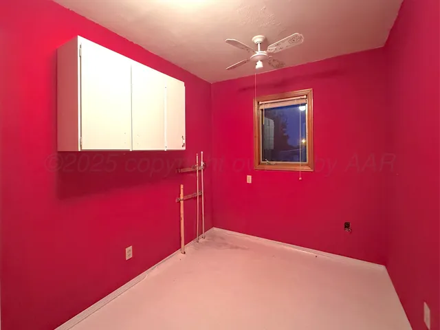 a view of a big room with a large window