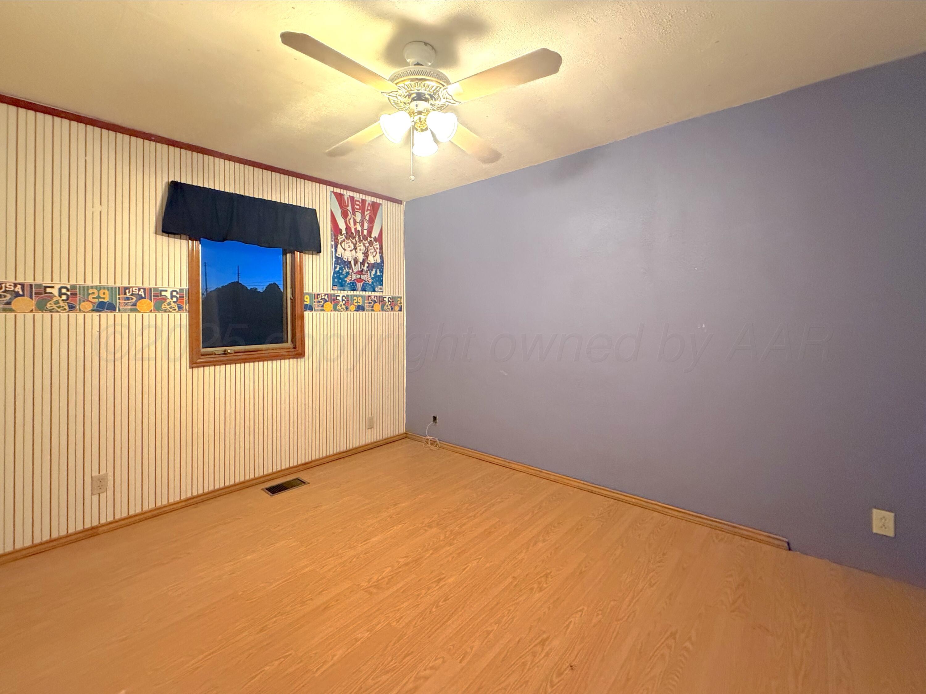 301 West 10th Street Stinnett, TX 79083 - Photo 8 of 15 an empty room with a window