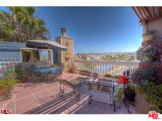 33 Reef Street, Unit 1 Marina del Rey, CA 90292 - Photo 1 of 7 a view of a wooden chairs and table in patio