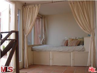 33 Reef Street, Unit 1 Marina del Rey, CA 90292 - Photo 6 of 7 a bedroom with a bed and a window