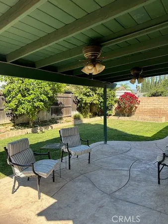 a patio with a table and chairs