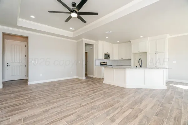 a view of kitchen with wooden floor and window