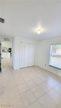 a view of an empty room and a window