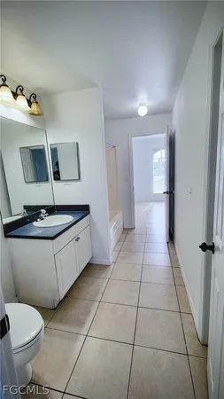a bathroom with a toilet and a sink