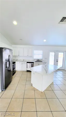 a kitchen with a cabinets and appliances
