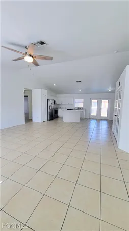 a view of a room with a projector and a rug