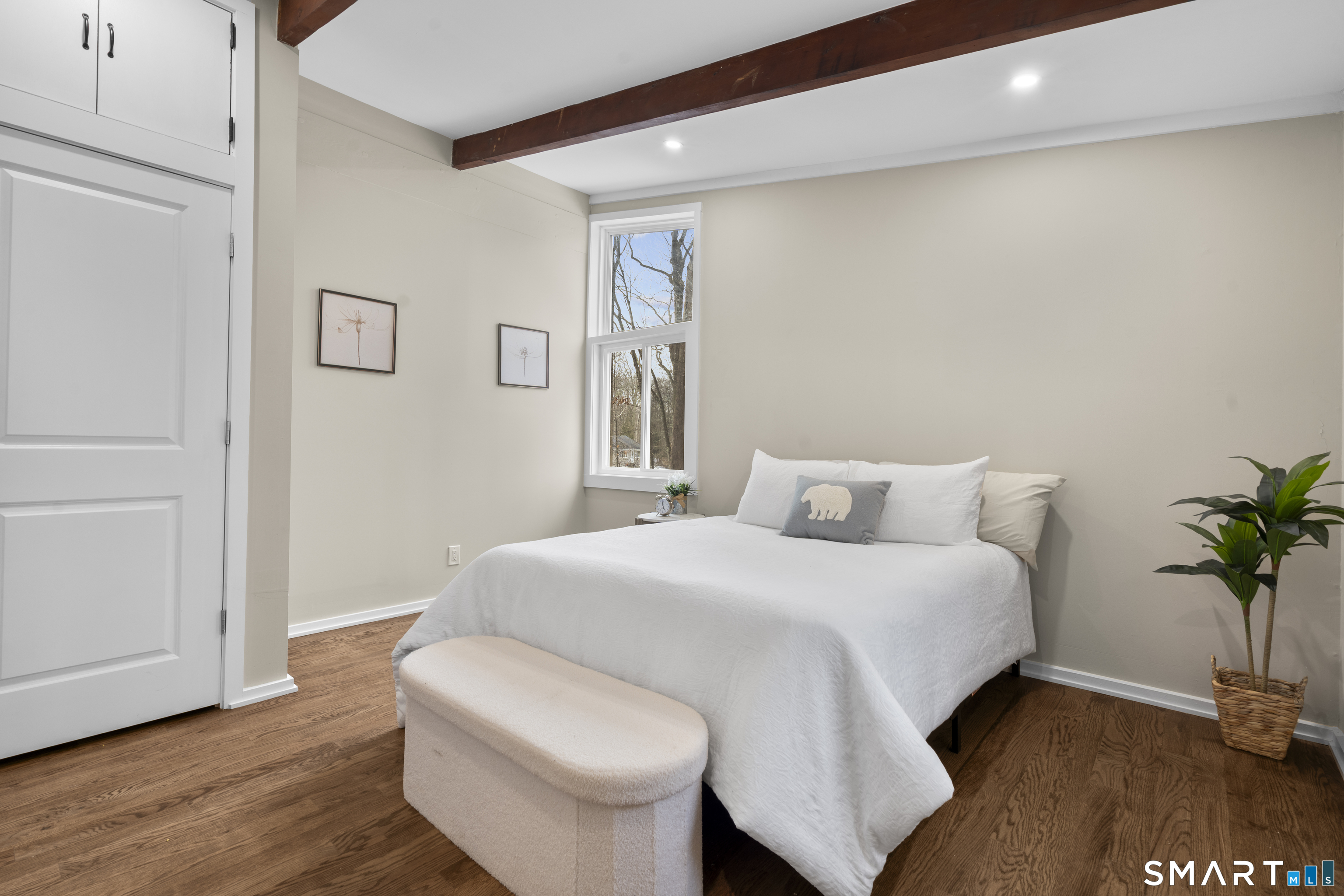 143 Gaylord Mountain Road Bethany, CT 06524 - Photo 12 of 30 a bedroom with a bed and a potted plant