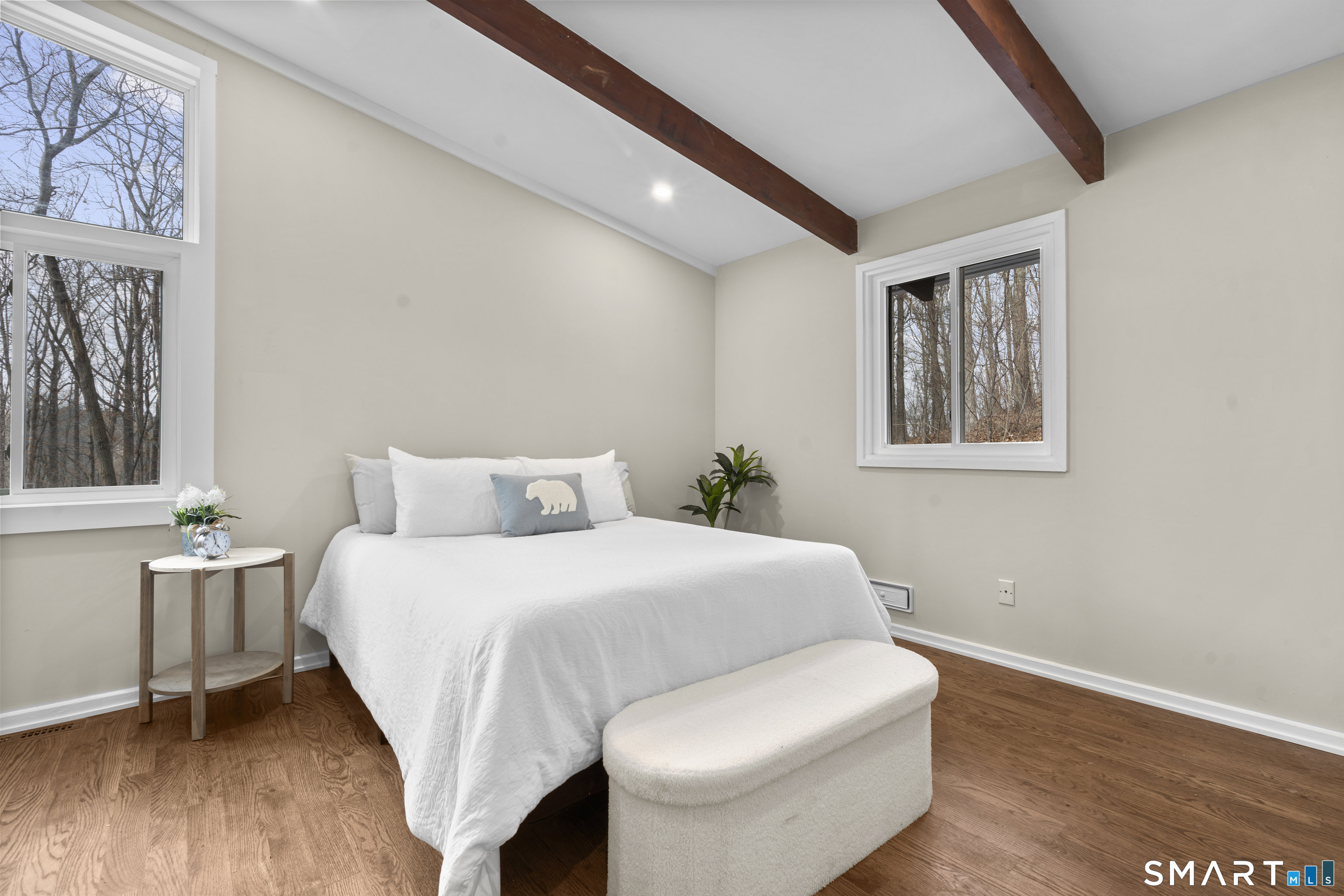 143 Gaylord Mountain Road Bethany, CT 06524 - Photo 13 of 30 a bedroom with a bed and wooden floor