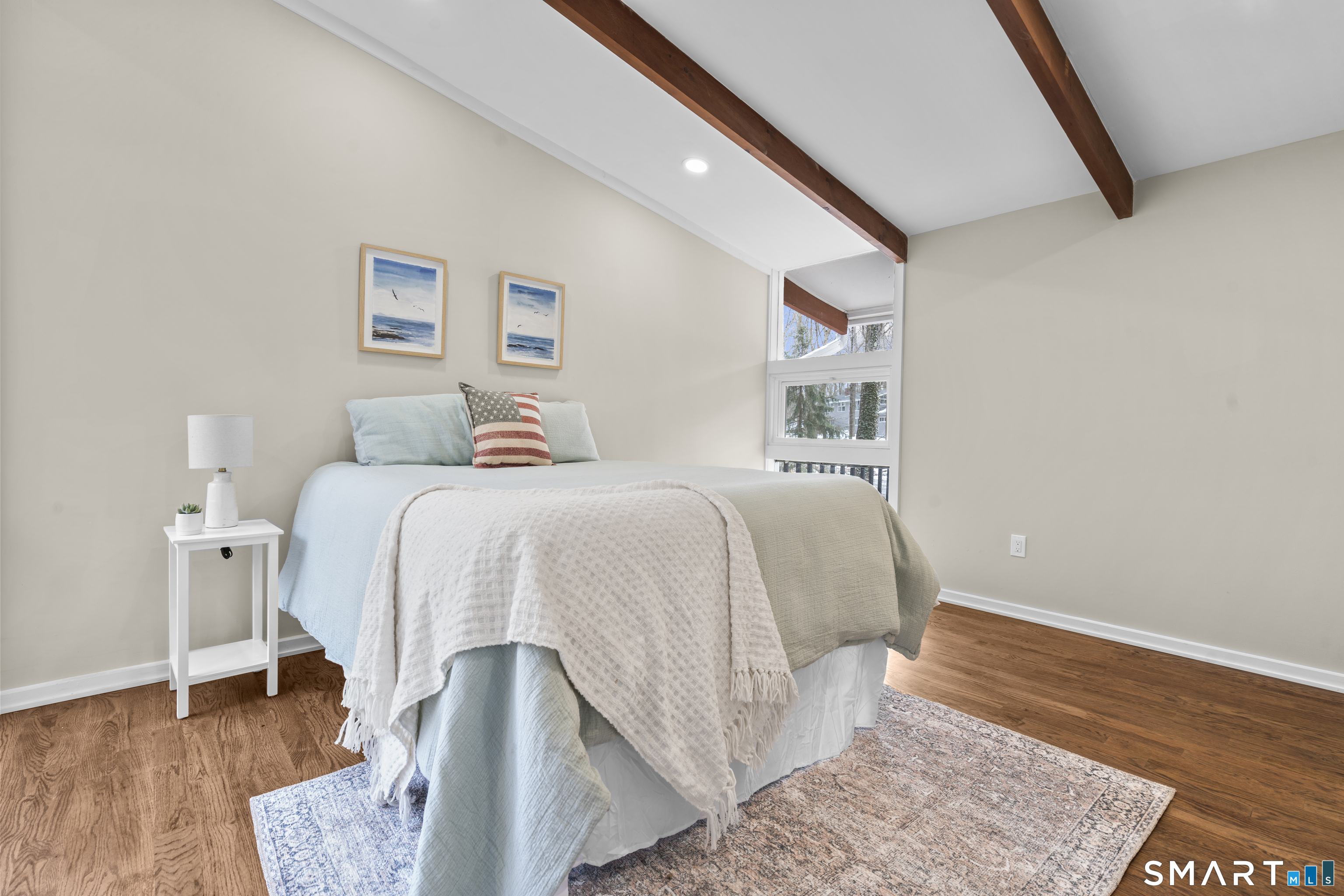 143 Gaylord Mountain Road Bethany, CT 06524 - Photo 14 of 30 a bedroom with a bed and wooden floor