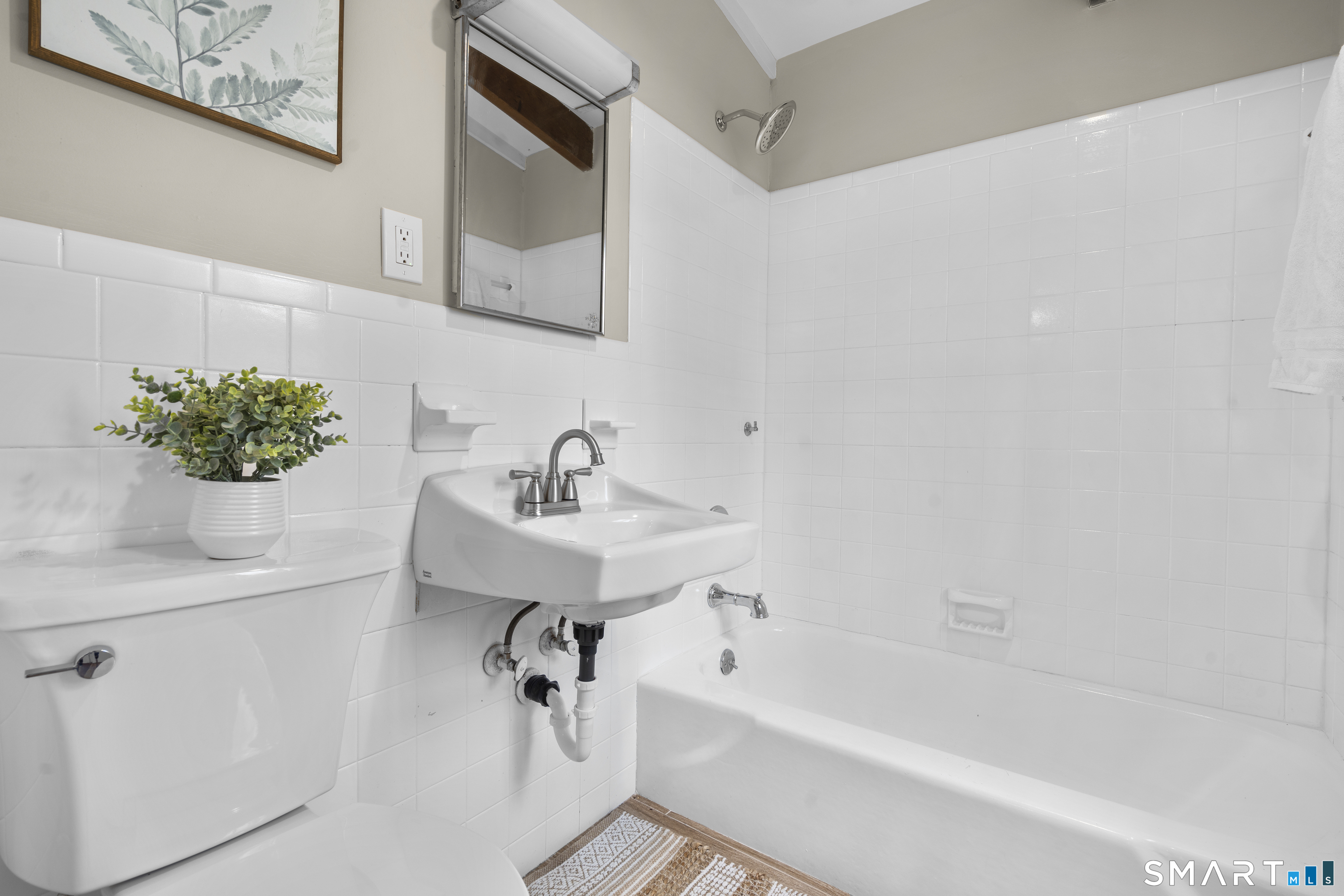 143 Gaylord Mountain Road Bethany, CT 06524 - Photo 15 of 30 a bathroom with a sink a mirror and a bathtub