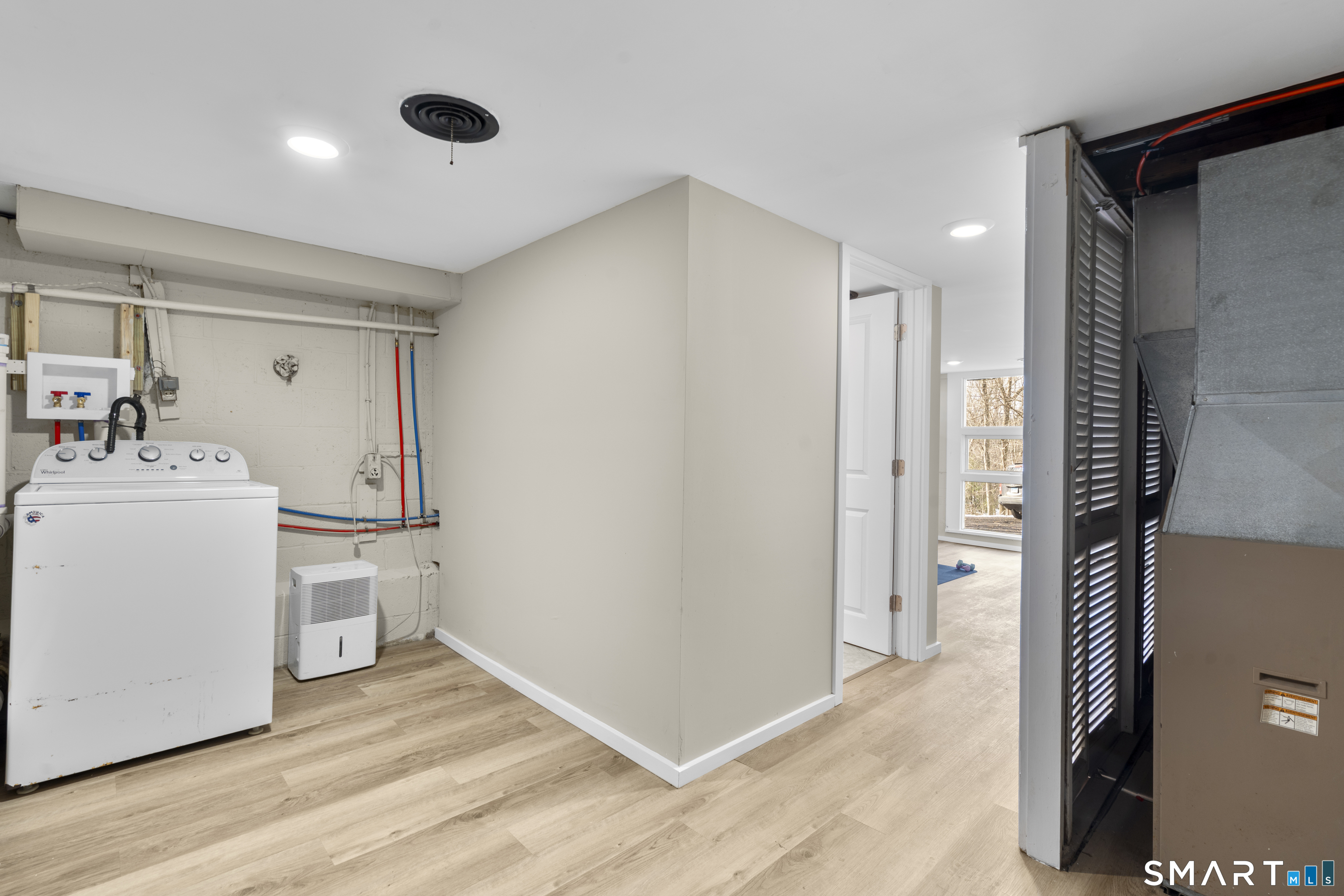 143 Gaylord Mountain Road Bethany, CT 06524 - Photo 19 of 30 a room with a washer and dryer