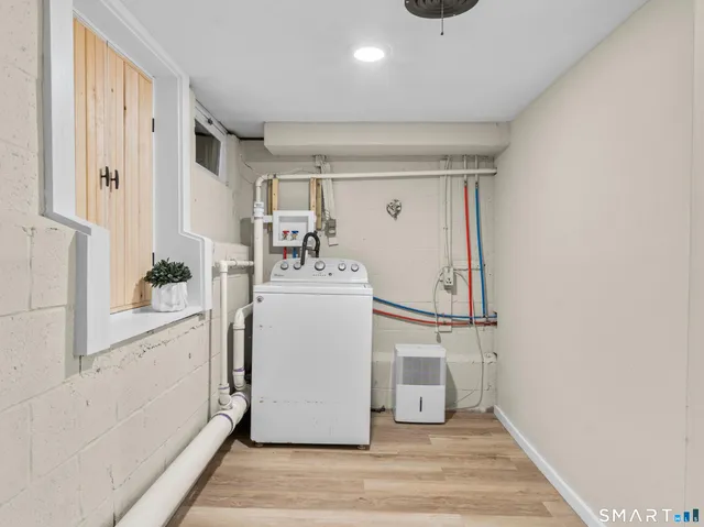 a view of balcony with wooden floor and fence