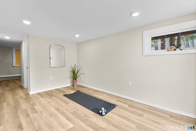 a view of a house with a small yard next to a road