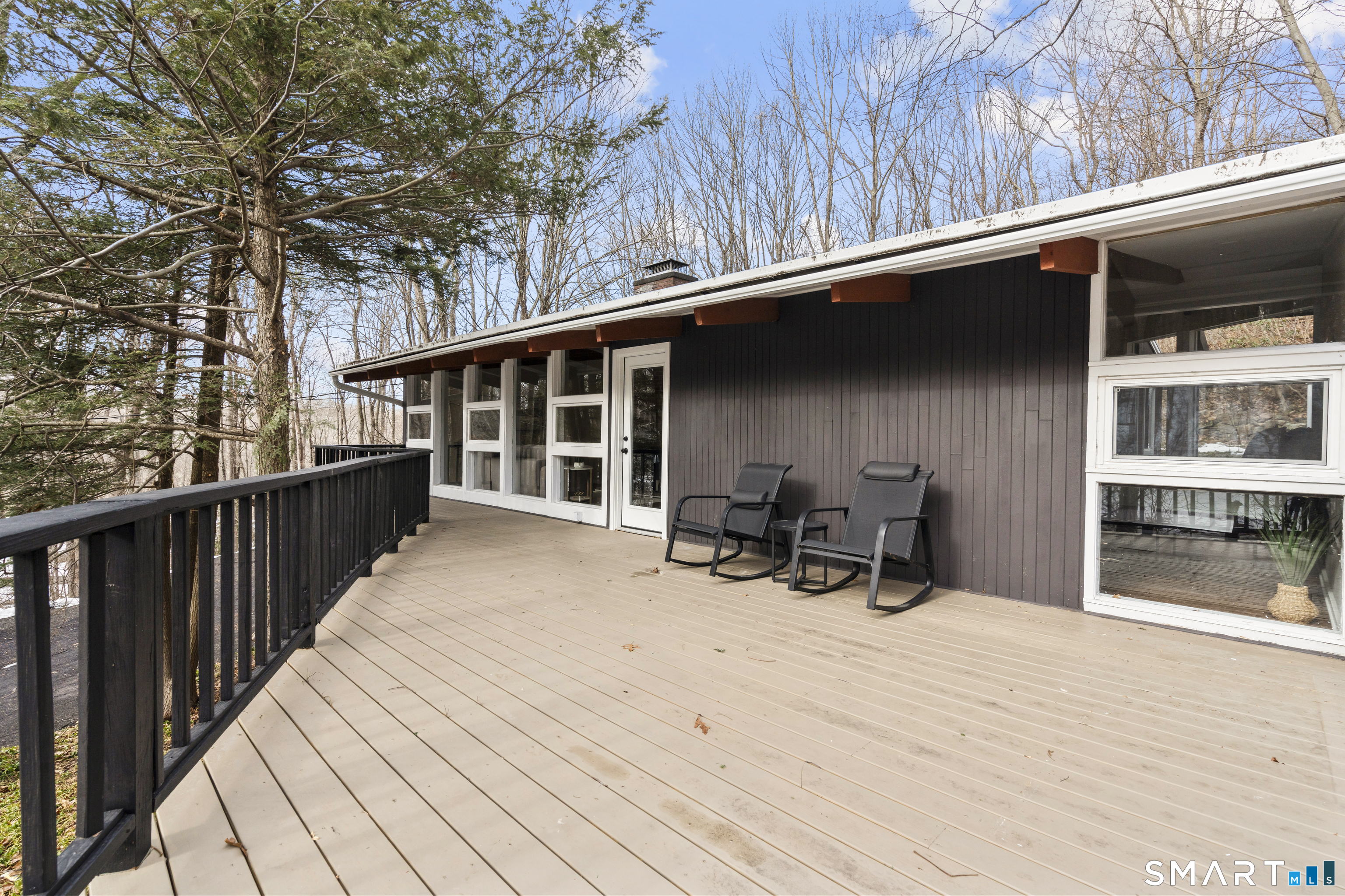 143 Gaylord Mountain Road Bethany, CT 06524 - Photo 24 of 30 a roof deck with table and chairs and wooden floor