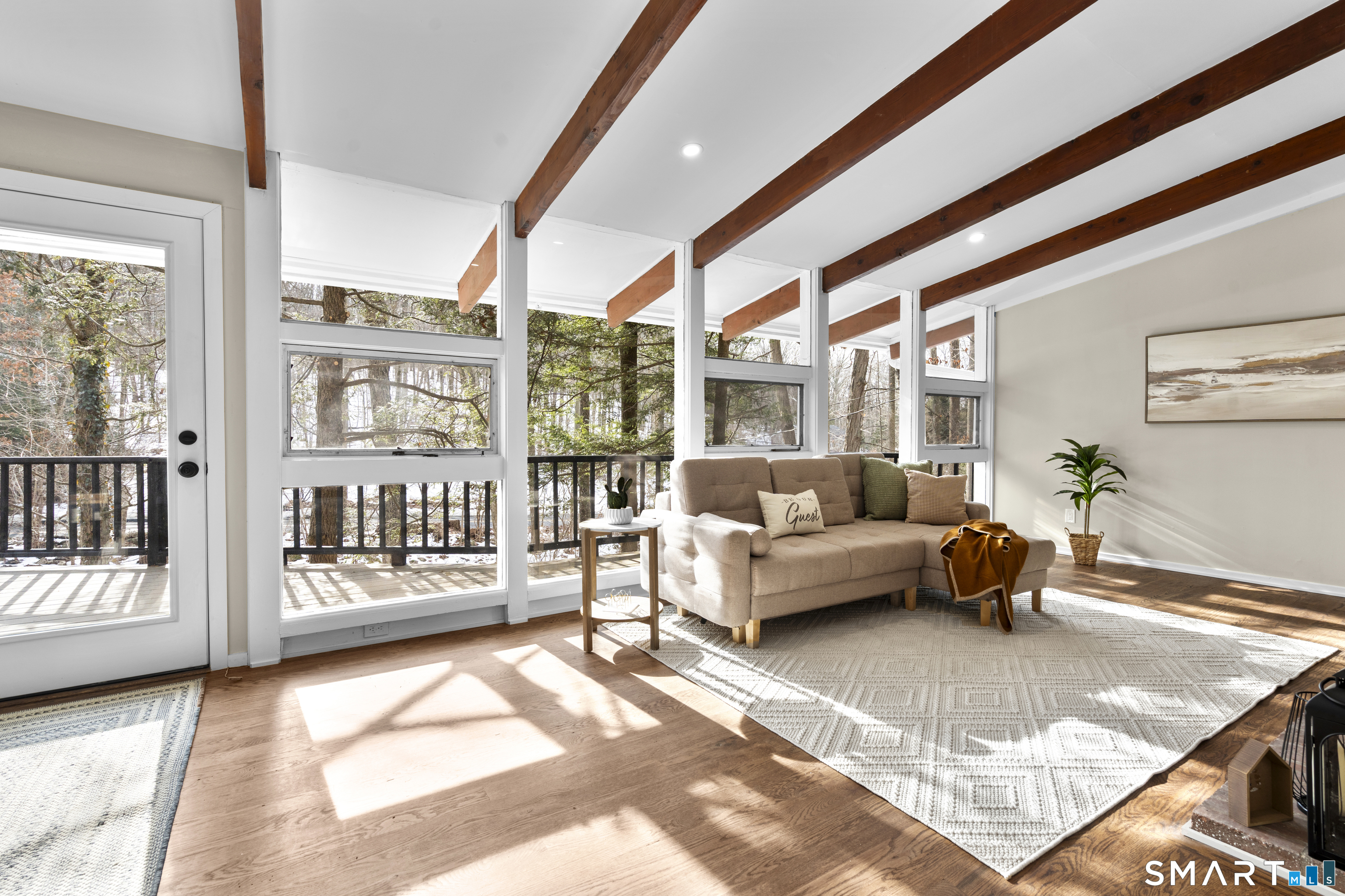 143 Gaylord Mountain Road Bethany, CT 06524 - Photo 7 of 30 a living room with furniture and a floor to ceiling window