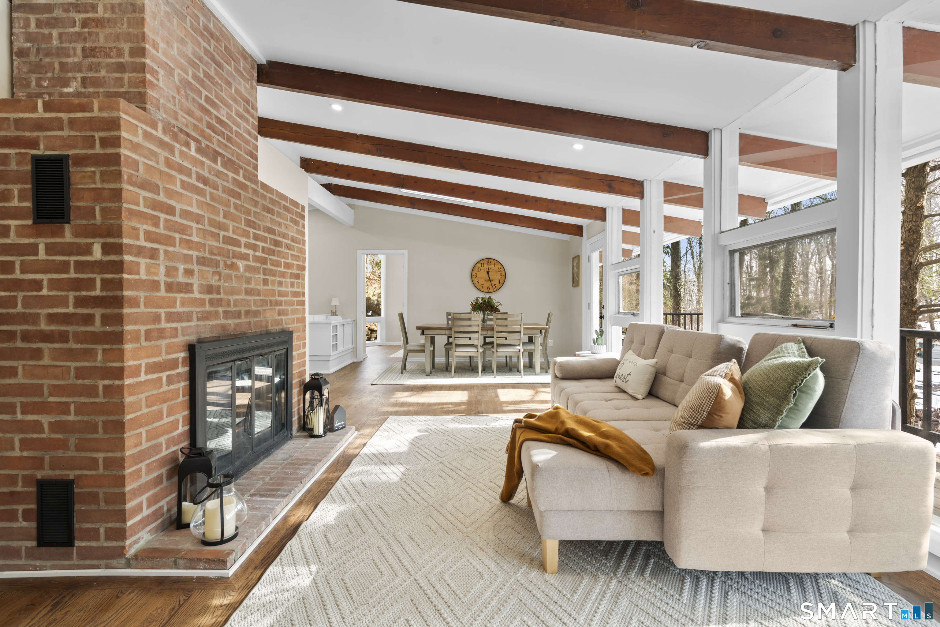 143 Gaylord Mountain Road Bethany, CT 06524 - Photo 10 of 30 a living room with furniture and a fireplace