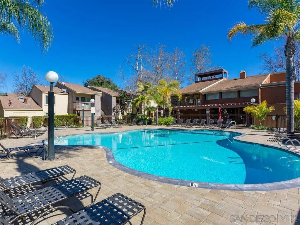 5950 Rancho Mission Road, Unit 166 San Diego, CA 92108 - Photo 15 of 18 a view of a swimming pool with sitting area