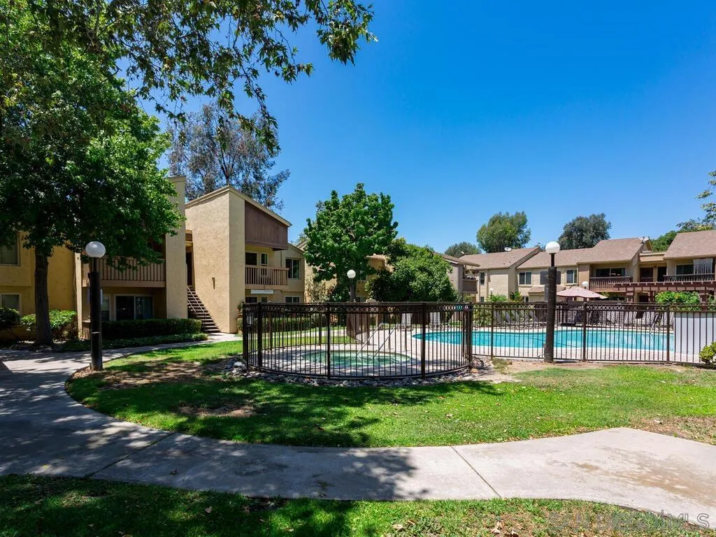 5950 Rancho Mission Road, Unit 166 San Diego, CA 92108 - Photo 3 of 18 a view of a house with a yard