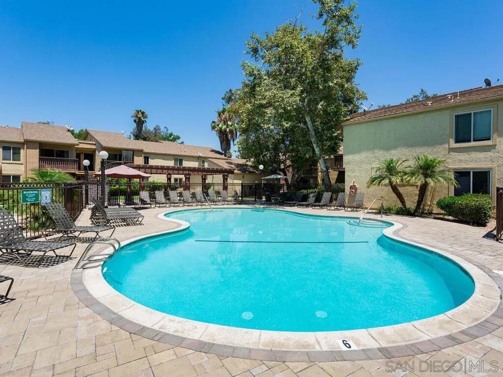 5950 Rancho Mission Road, Unit 166 San Diego, CA 92108 - Photo 5 of 18 a view of a swimming pool with outdoor seating