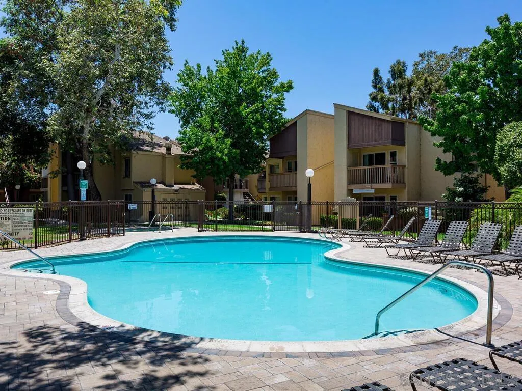 5950 Rancho Mission Road, Unit 166 San Diego, CA 92108 - Photo 7 of 18 a view of a house with swimming pool patio and swimming pool