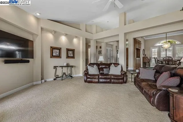 a kitchen that has a sink a stove and a table