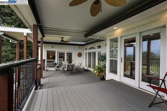 a kitchen with stainless steel appliances granite countertop a refrigerator a stove a sink dishwasher with a dining table and chair