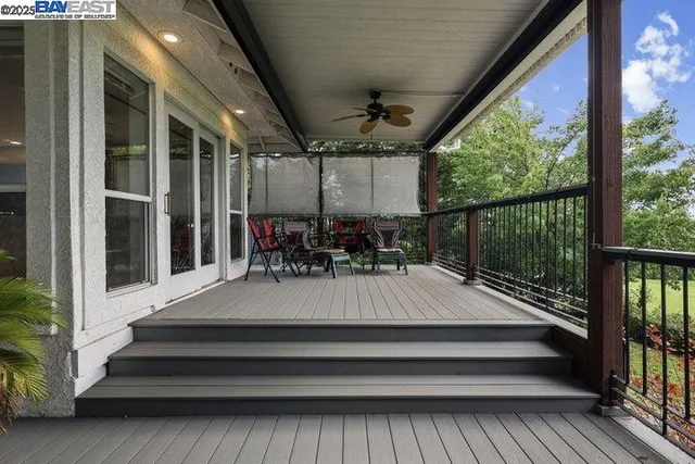 a kitchen with refrigerator a sink and chairs