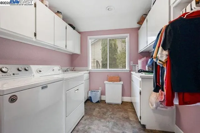a view of a livingroom with workspace and a window