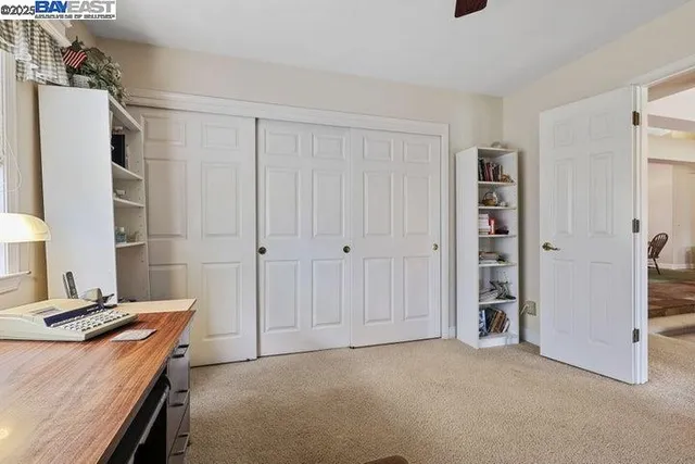 a spacious bathroom with a sink and a large mirror