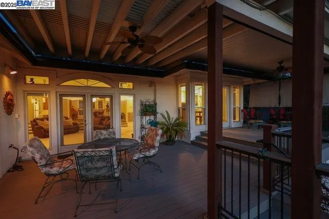 a view of a balcony with a yard