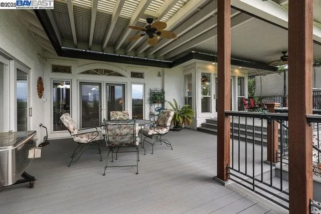 a view of a grassy field with trees in the background