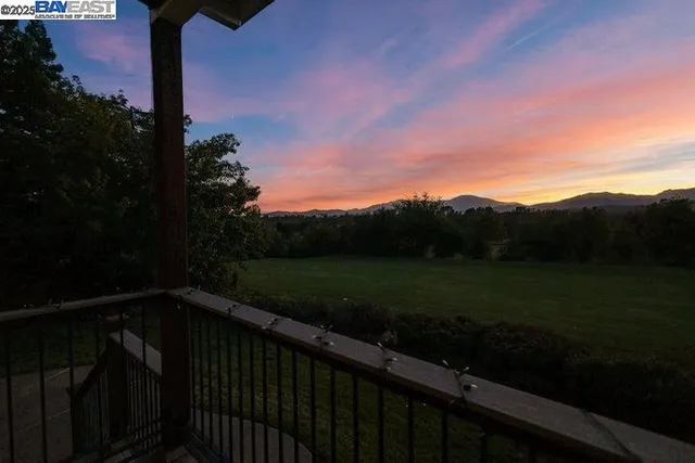 an aerial view of residential house with outdoor space and lake view