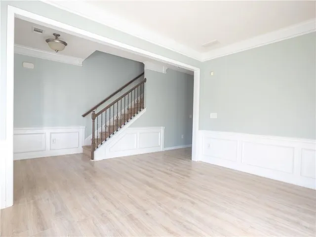 a view of an entryway with wooden floor