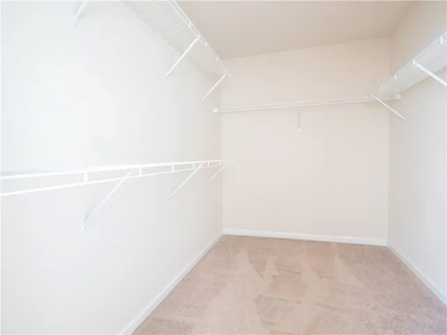 a bathroom with a granite countertop bathtub shower and vanity