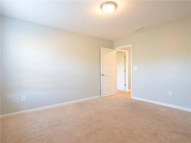 a white toilet sitting next to a white sink