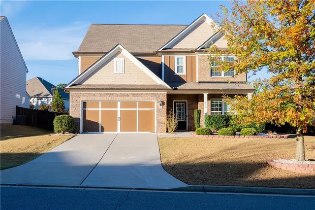 a front view of a house with a yard