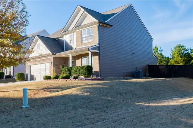 a front view of a house with a yard