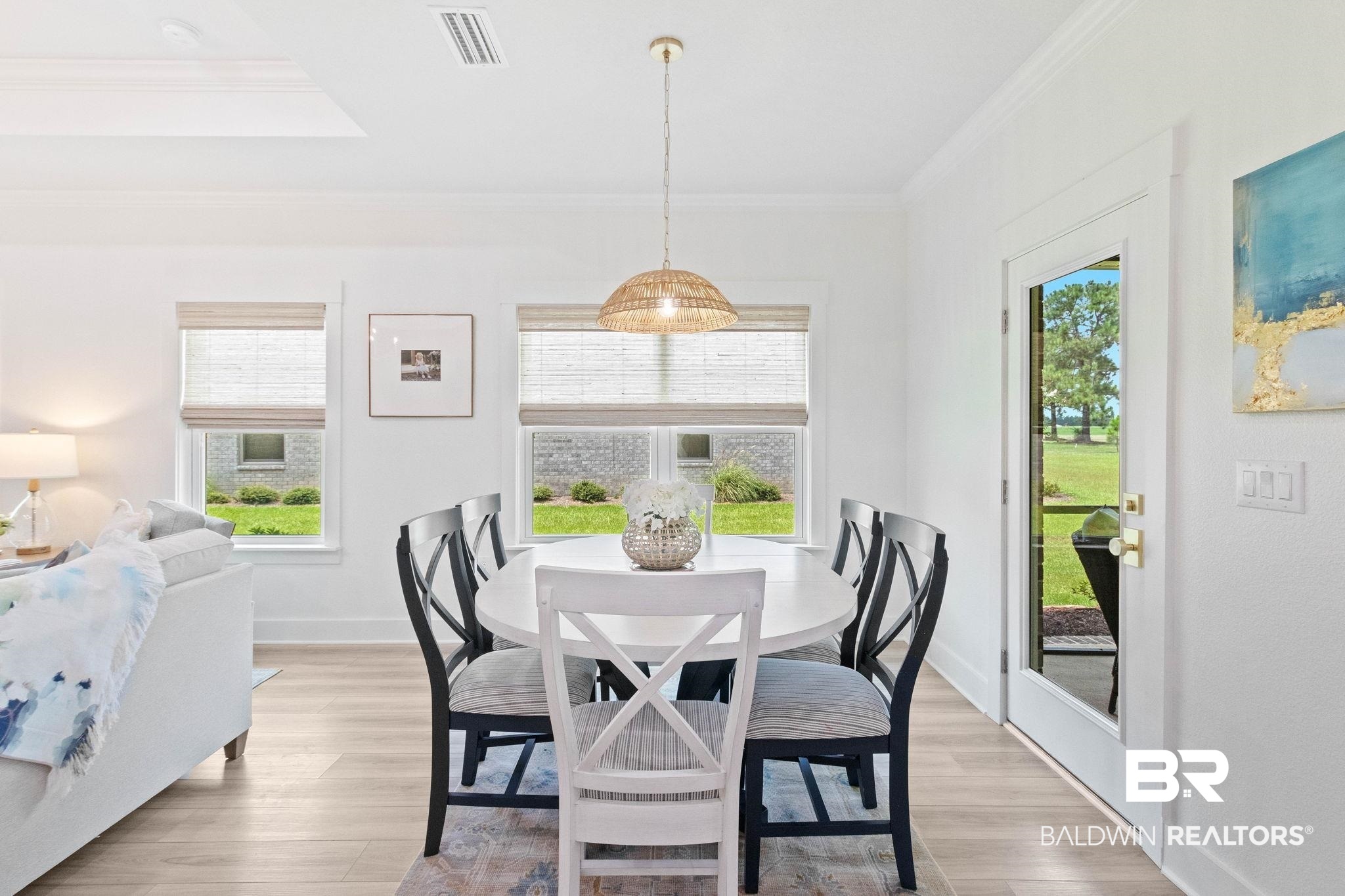 9815 Lakeview Drive Foley, AL 36535 - Photo 28 of 100 Dining area with light hardwood / wood-style flooring and ornamental molding