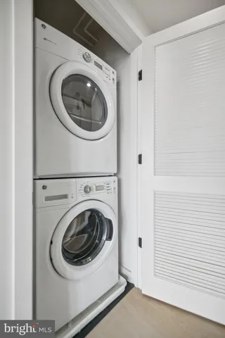 a bathroom with a sink toilet double vanity and shower