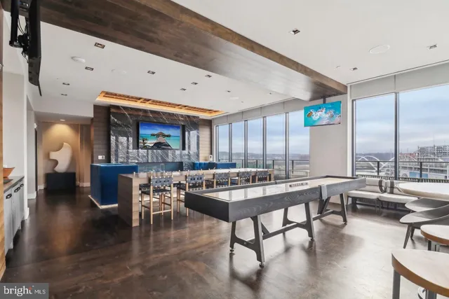 a very nice looking living room with a large window and furniture