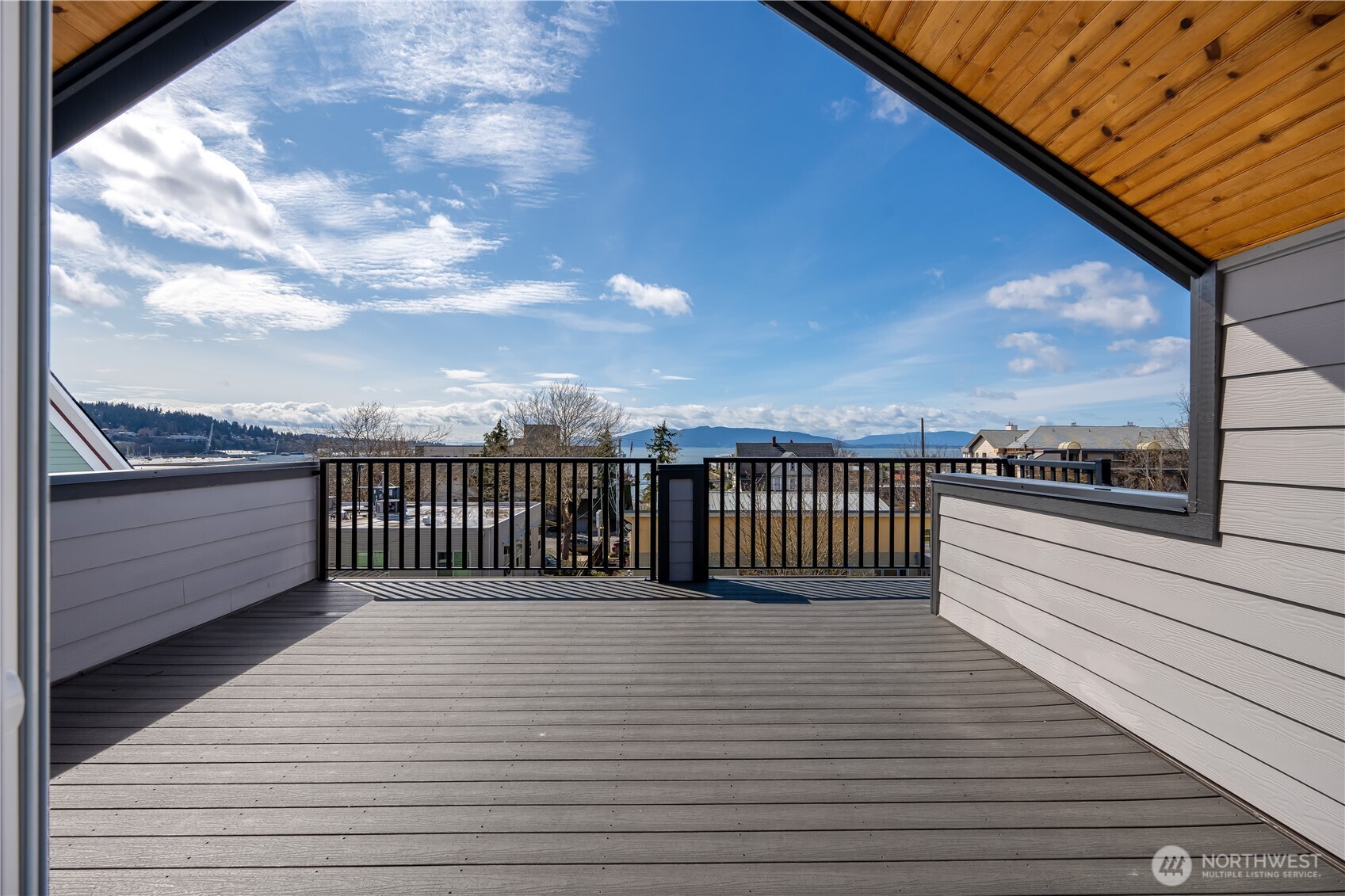 a view of a balcony with a barbeque