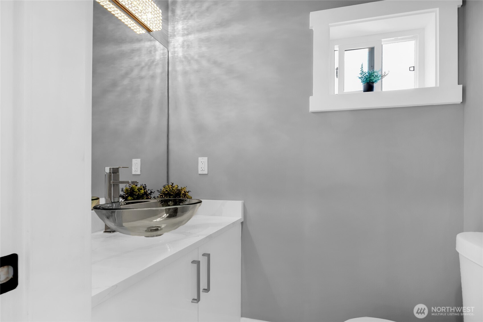 1315 Astor Street Bellingham, WA 98225 - Photo 11 of 34 a bathroom with a sink and a mirror